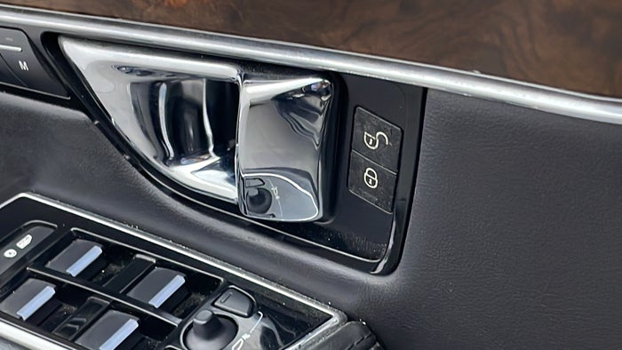 JAGUAR XJ-Door Interior LHS front Button Faded