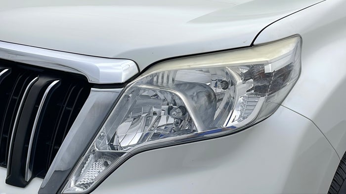 TOYOTA PRADO-Head Light LHS Fading