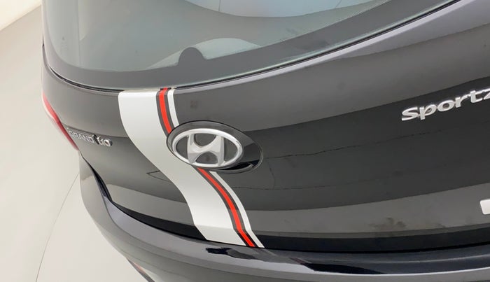 2014 Hyundai Grand i10 SPORTZ AT 1.2 KAPPA VTVT, Petrol, Automatic, 1,06,876 km, Dicky (Boot door) - Graphic sticker