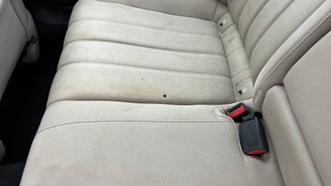 Seat 2nd row RHS Cigarette burn
